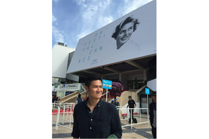 A man with black shirt smiling